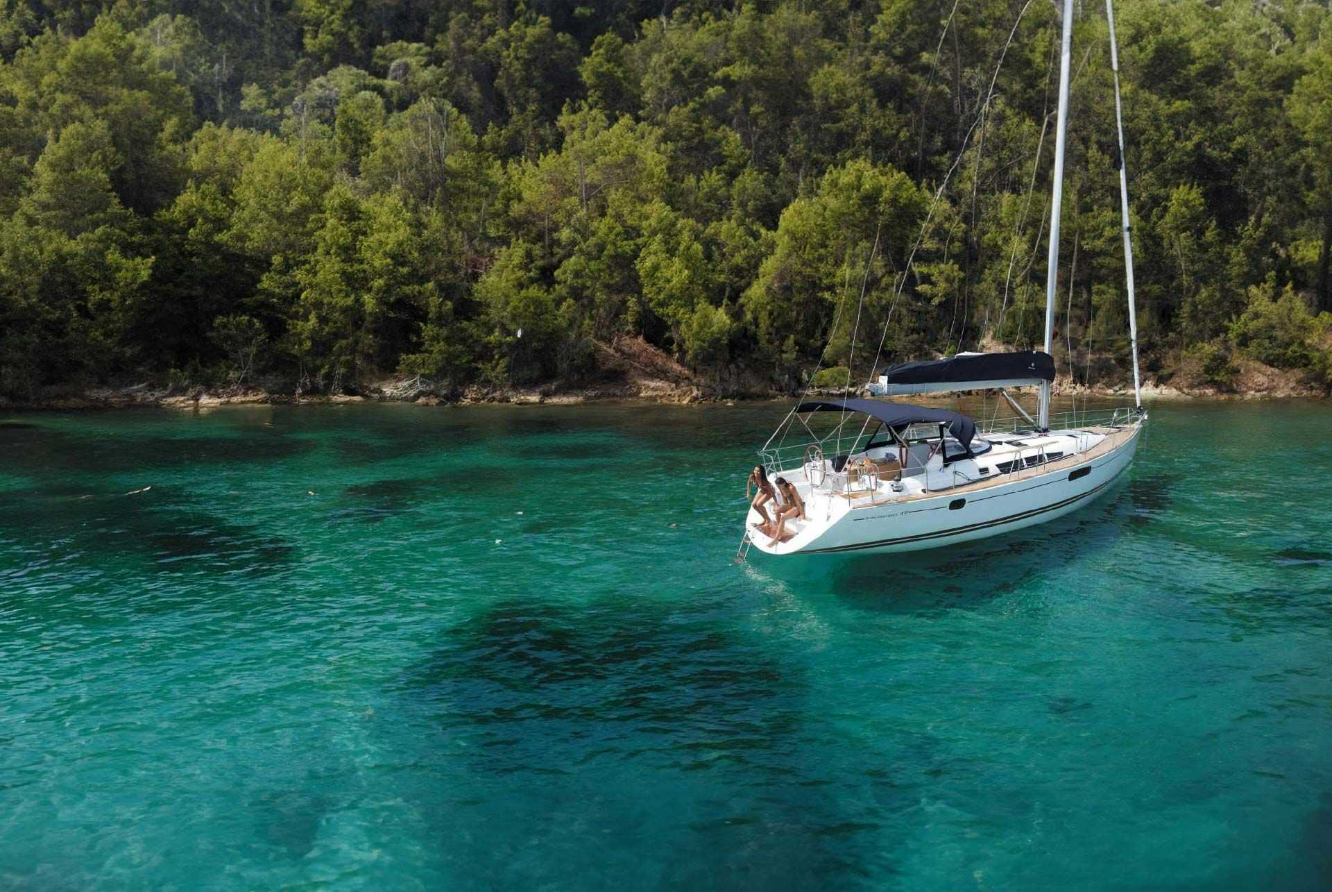 MedSailors Economy Yacht anchored in a clear water bay