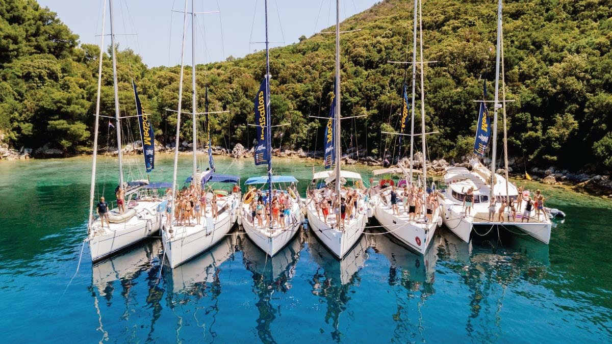 MedSailors flotilla of yachts anchored in a beautiful bay