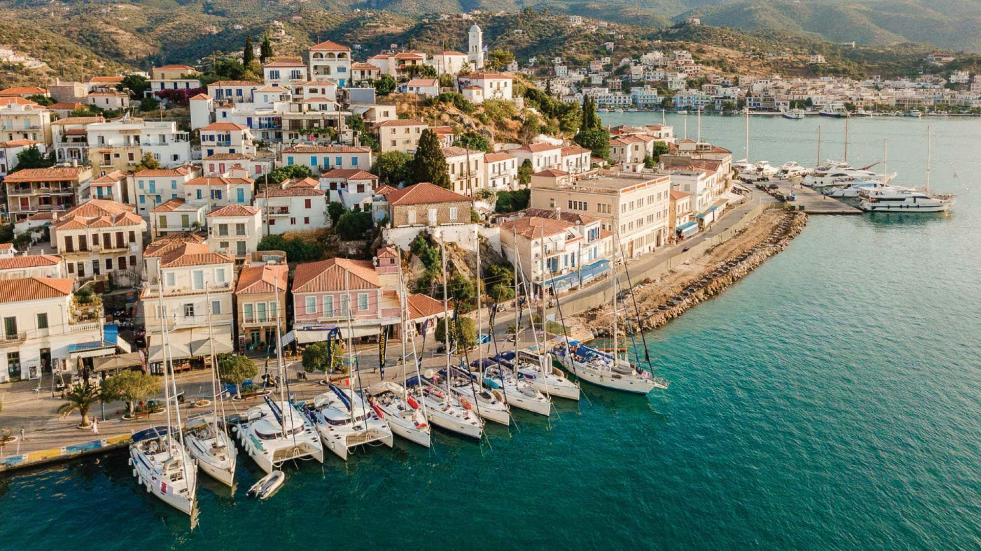 MedSailors yachts lined up on the town quay in Poros